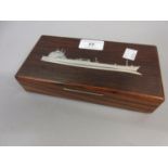 Mid 20th Century rosewood cigarette box, the cover inlaid with a ship