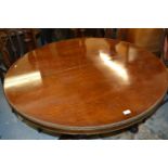 Late Regency circular exotic hardwood veneered pedestal table, the crossbanded top with gadroon