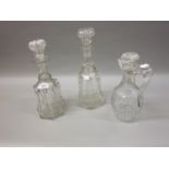 Early 19th Century heavy cut glass jug, together with two similar cut glass decanters with stoppers