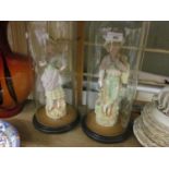 Pair of 19th Century French bisque porcelain figures of lady and gallant housed under glass domes