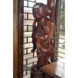 Large mid 20th Century Chinese carved hardwood lamp base in the form of a standing figure, 25ins