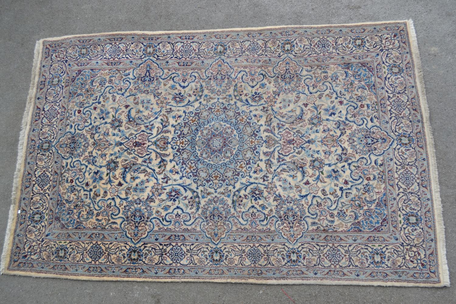 Indo Persian rug with a medallion and all-over floral design on an ivory ground with borders