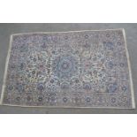 Indo Persian rug with a medallion and all-over floral design on an ivory ground with borders