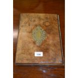 Victorian figured walnut book cover with pierced brass decoration