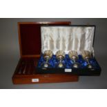 Cased set of twelve silver plated fish knives and forks together with a cased set of four silver