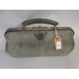 Leather Gladstone type Doctor's bag, an A.A. car badge, amber cigar holder and sundries