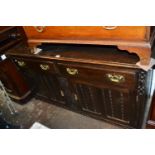 Late 19th or early 20th Century oak sideboard with two drawers above two panelled doors together