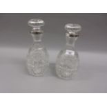 Pair of good quality cut glass decanters with stoppers with white metal collars