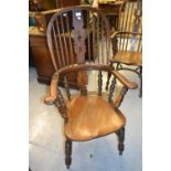 19th Century elm Windsor elbow chair, the hoop back with pierced splat and turned spindles above