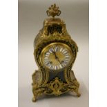 19th Century French buhl work mantel clock, the circular gilt metal dial with enamel Roman