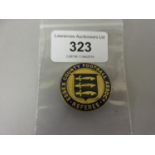 Circular gilt metal and enamel Essex County Football Association referee badge