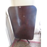 19th Century mahogany rectangular pedestal breakfast table with a tilt top above a turned column