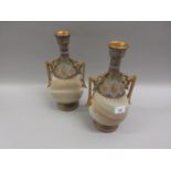 Pair of Continental pottery two handled vases decorated in blue, green and gilt with simulated stone