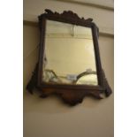 Small Georgian mahogany wall mirror with shaped surmount and frieze