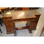 Unusual Gillow amboyna breakfront writing table, the leather inset top with brass gallery above