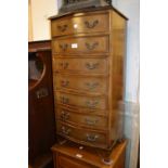 Tall narrow reproduction mahogany serpentine fronted chest of seven drawers with brass swan neck