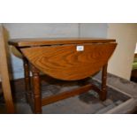 Reproduction oak drop-leaf occasional table