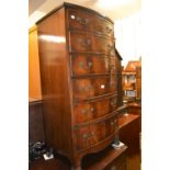 Mid 20th Century mahogany narrow bow front chest of six graduated drawers with brass handles on