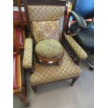 Late Victorian drawing room armchair and a Victorian walnut circular upholstered footstool, 19th