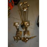 Set of four brass fire irons, pair of large brass candlesticks, two brass figures of a pheasant