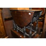 Small early 18th Century oak oval gate leg table with a single end drawer on baluster turned