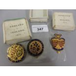 Group of three gilt metal and enamel badges, Ireland V England, England V Wales 1912 and England V