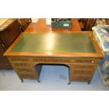 Edwardian mahogany and satinwood crossbanded twin pedestal writing desk with leather inset top