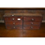 Late 19th / early 20th Century mahogany bank of six short drawers with knob handles containing a