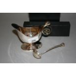 Sarah Jones, a modern silver helmet shaped pedestal cream jug with Swan pattern handle together with