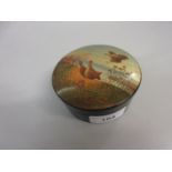 Russian circular papier mache box, the cover painted with game birds in a landscape, signed