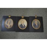 Three 19th Century miniature portraits of a lady and two gentlemen, ebonised and gilt frames