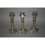 Three matching antique style silver plated knopped stem candlesticks