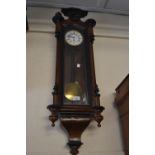 Small 19th Century and part ebonised Vienna wall clock, the enamel dial with Roman numerals, with