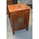 Small mid 20th Century Chinese elm side cabinet, the moulded top above a pair of doors with brass