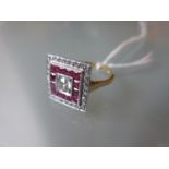 18ct Yellow gold ring of square design set central brilliant cut diamond, surrounded by a band of