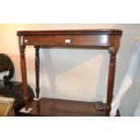 George III mahogany and line inlaid D shaped fold-over tea table on turned tapering supports