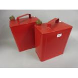 Two Valor red petrol cans with brass screw caps