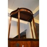 Reproduction mahogany side table with a shaped top and single drawer raised on square tapered