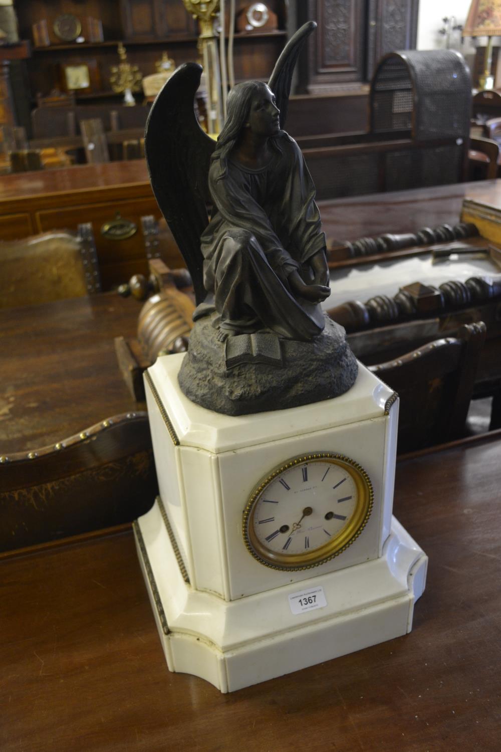 19th Century French white marble and spelter mounted mantel clock, the pillar shaped case with an