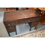 Chinese carved hardwood twin pedestal desk, the rectangular top above five carved drawers on