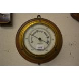John Barker and Co., Kensington, circular gilt brass ship's bulkhead barometer