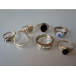 9ct Gold ring set large white stones, two 9ct gold and black onyx set signet rings and four other