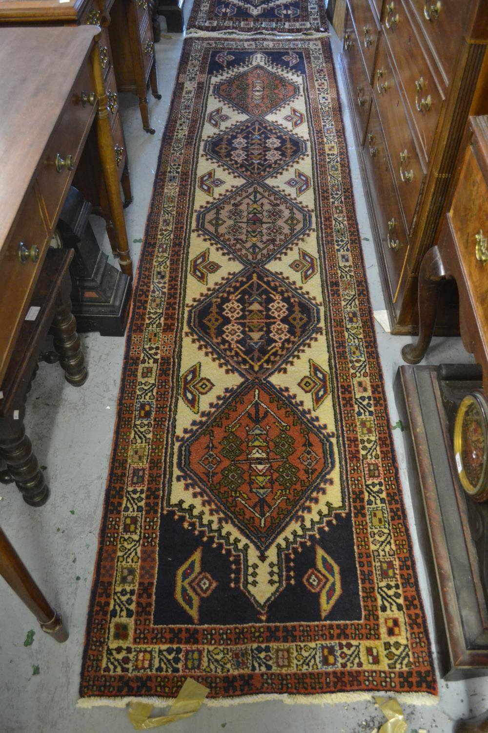 Near pair of Persian runners of geometric floral design with multiple borders, 2ft 2ins x 9ft 4ins