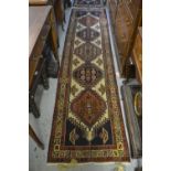 Near pair of Persian runners of geometric floral design with multiple borders, 2ft 2ins x 9ft 4ins