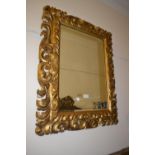 19th Century Florentine type carved and gilded rectangular wall mirror with bevelled plate, 35ins