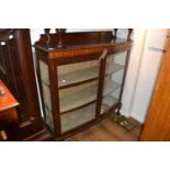 1920's Mahogany two door bow fronted display cabinet on claw and ball feet