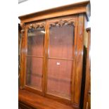 Victorian mahogany secretaire bookcase, the moulded cornice above two glazed doors, the base with