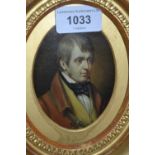 19th Century oval gilt framed portrait miniature of a gentleman wearing a red coat and yellow
