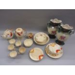 Susie Cooper part tea service including a teapot, hot water pot and sugar bowl decorated with a