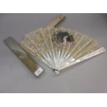 19th Century French lace work fan painted with figures and birds in a garden scene, housed in a box,